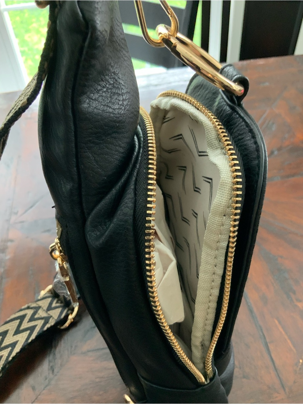 Moda Luxe Black Sling Bag with Patterned Chevron Strap - Picture 2 of 7